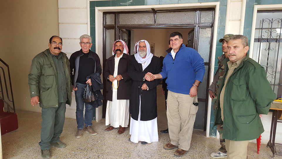 Meeting with local authorities to coordinate aid delivery