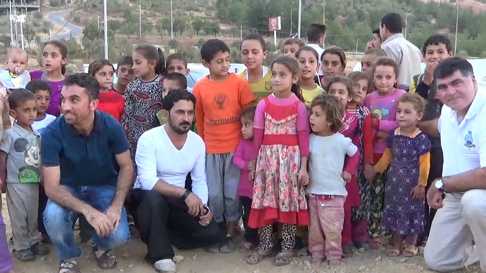 Children receiving aid in Iraq, summer 2016