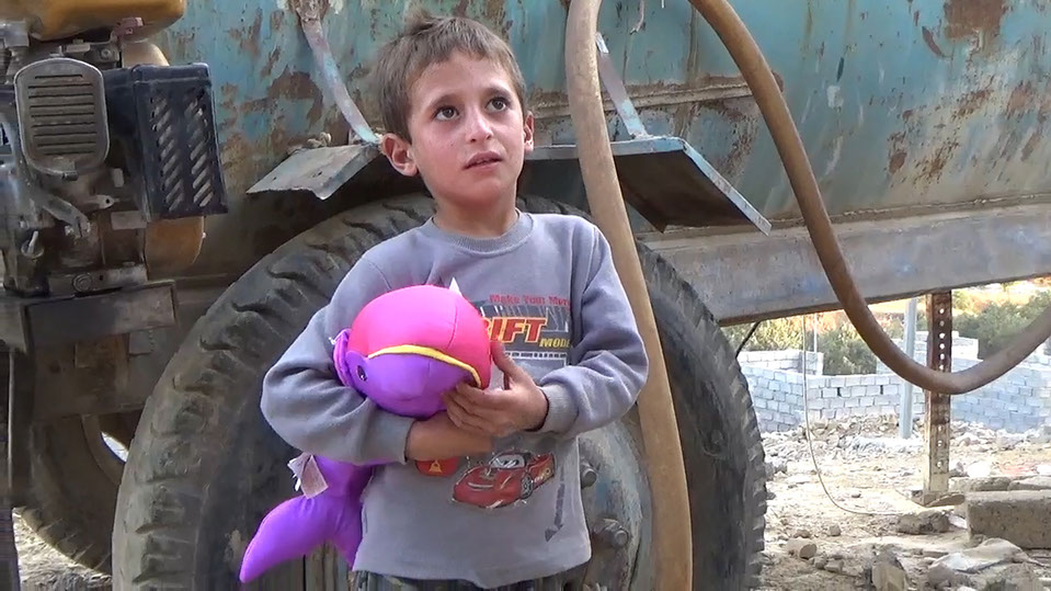Child receiving toys, Iraq relief trip